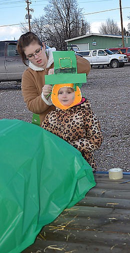 &lt;p&gt;&lt;strong&gt;Mother Chanona Grieff helps pin down a hand-made hat her daughter and Girl Scout Rory Greiff, 5, before Rory gets on the Ronan combined Daisy, Brownie and Girl Scout troop&#146;s float. In all, 13 Girl Scouts and their two leaders Amanda Blixt and Francis Stokes rode on the float.&lt;/strong&gt;&lt;/p&gt;&lt;div&gt;&lt;strong&gt;&#160;&lt;/strong&gt;&lt;/div&gt;