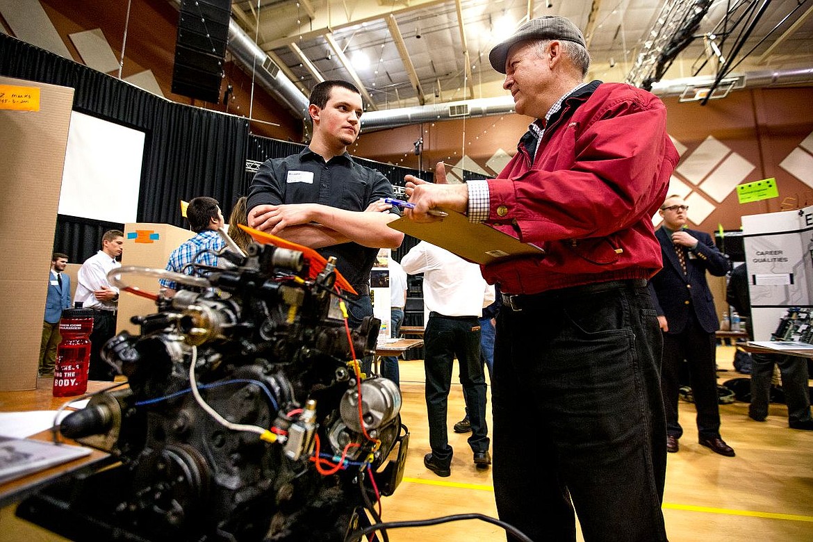 &lt;p&gt;Post Falls High School student Brandon Wander, left, discusses his interests in a career in diesel technology and marine motor transport with Craig Nicol of Racers Incorporated on Wednesday at the Idaho Department of Labor's 10th annual Reverse Job Fair at Real Life Ministries in Post Falls.&lt;/p&gt;