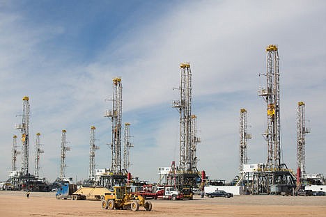 &lt;p&gt;This Jan. 26 photo shows a number of idle oil drilling rigs in Helmerich &amp; Payne International Drilling Company's yard in Ector County, Texas. Companies are leaning on new techniques and technology to get more oil out of every well they drill, and furiously cutting costs in an effort to keep U.S. oil competitive with much lower-cost oil flowing out of the Middle East, Russia and elsewhere.&#160;&lt;/p&gt;