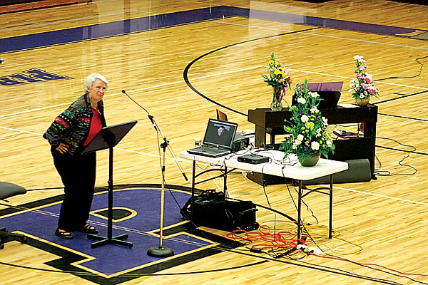 Marsha Anson demonstrates Barry Webb&#146;s enthusiasm when greeting friends at his memorial service.