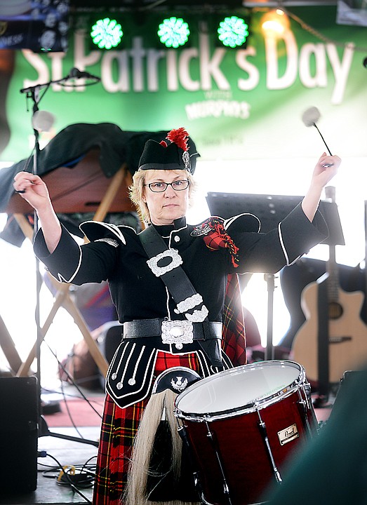 <p>JoDee Anderson on the tenor drum and members Montana Highlanders perform at the Brannigan's Tent on Monday, March 17, as part of the Saint Patrick's Day celebration. (Brenda Ahearn/Daily Inter Lake)</p>