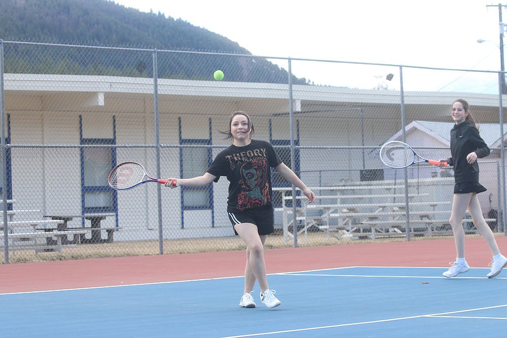 <p>Lenaya Simpson prepares to lob the tennis ball back to her opponent during a recent practice at the courts near Superior High School.</p>