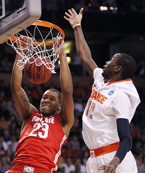 &lt;p&gt;Ohio State center Amir Williams (23) dunks while defended by Syracuse center Baye Keita (12) during the first half of the East Regional final Saturday at Boston.&lt;/p&gt;