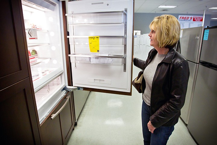 &lt;p&gt;Cheryl Schwartz browses the refrigerators at Fred's Appliance in Coeur d'Alene while waiting for her order to be completed Wednesday. The State Energy Efficiency Appliance Rebate Program is providing rebates ranging on certain Energy Star appliances.&lt;/p&gt;