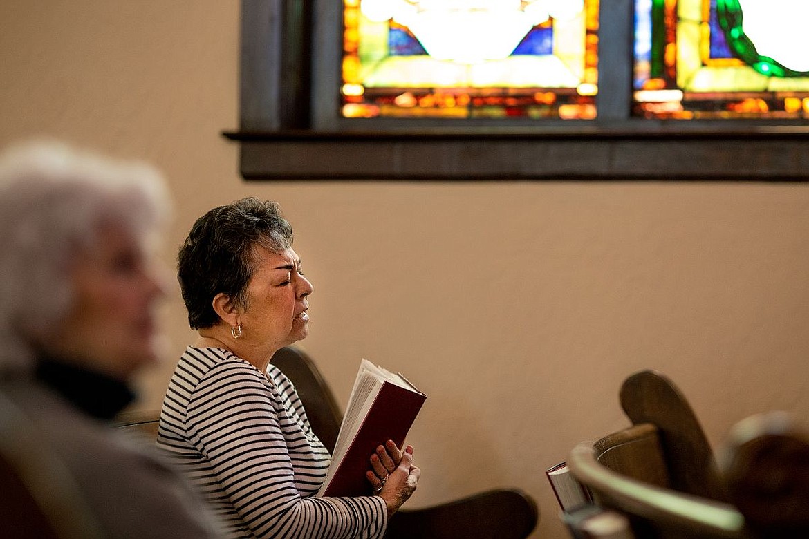 &lt;p&gt;JAKE PARRISH/Press Linda Jones, who has been attending the First Presbyterian Church of Coeur d'Alene for 20 years, sings a hymn on Thursday at the church's Stations of the Cross gathering in Coeur d'Alene.&lt;/p&gt;