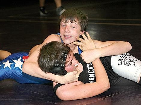 Photo by Ed Moreth Tyler Wharry, competing in the junior 125-pound class, puts a hold on Frenchtown Bronc Colby Hagen. Wharry defeated Hagen 14-0 at the Western Montana State Little Guy Wrestling Championships in Missoula Saturday to win his only match of the season. Wharry didn&#146;t place at the tournament.