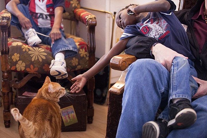 &lt;p&gt;Patrick Cote/Daily Inter Lake Sitting in his fathers lap, Alderson reaches out to the family cat, Rudy, Tuesday afternoon in Polson. Tuesday, March, 20, 2012 in Polson, Mont.&lt;/p&gt;