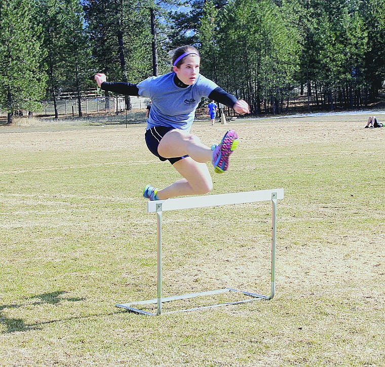 &lt;p&gt;Angela Padden jumps over a hurdle during practice. Padden has been a member of the track and field team for four years.&#160;&lt;/p&gt;