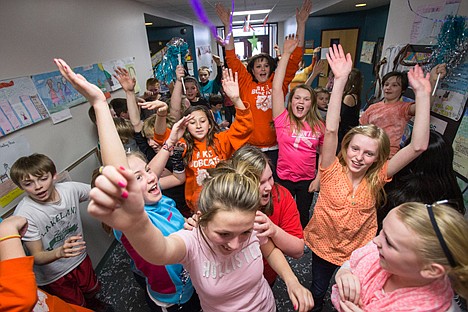 &lt;p&gt;Students and one teacher raise the roof while having a spontaneous dance party Tuesday in a hallway of Betty Kiefer Elementary. The dance party started while students were cleaning up confetti that was left after Betty Kiefer kids and the Lake City High School Student Council teamed up to make a &#147;lip dub&#148; video to promote Rachel&#146;s Challenge.&lt;/p&gt;