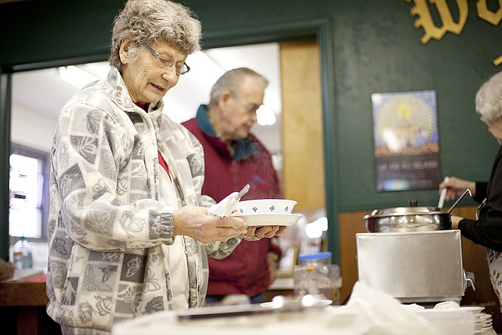 &lt;p&gt;Gerrie Boyle picks up her silverware after getting a bowl of corned beef and sauerkraut soup Tuesday afternoon at Soup&#146;s On in Polson.&lt;/p&gt;