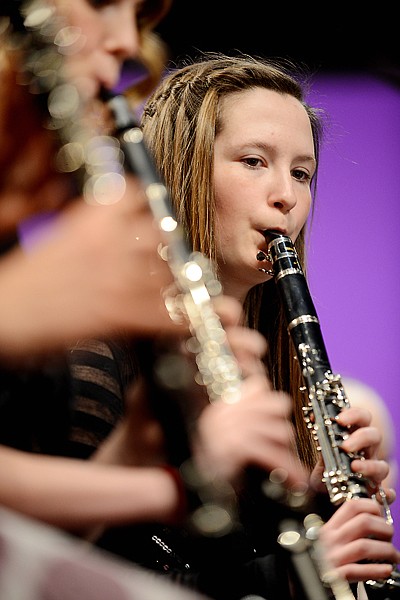 <p>Bailey Johnson of Bigfork and members of area middle school bands rehearse for the Honor Band Festival on Friday afternoon, March 22, at the Whitefish Performing Arts Center. (Brenda Ahearn/Daily Inter Lake)</p>