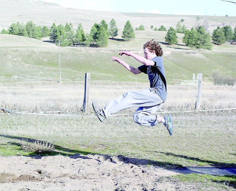 &lt;p&gt;Horsemen track and field athlete Jeffrey Marshall leaps through the air as he attempts to perfect his long jump technique.&lt;/p&gt;