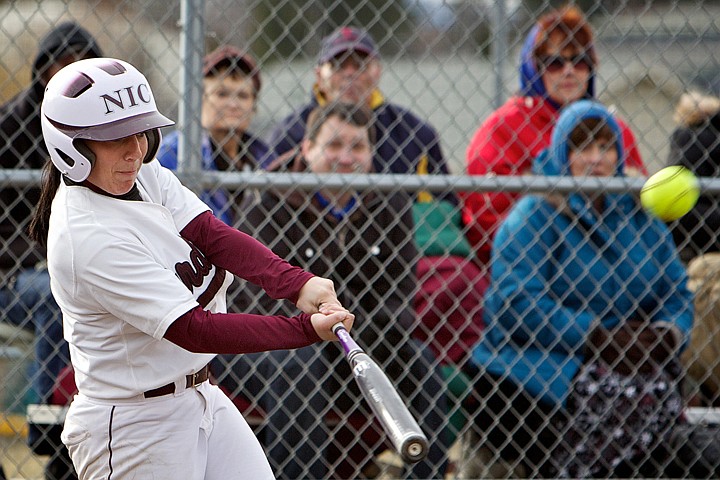 &lt;p&gt;North Idaho College's Brianna Bishop follows through her swing after making contact for a two-run homer Friday in the fourth inning of the Cardinal's game against Salt Lake Community College.&lt;/p&gt;