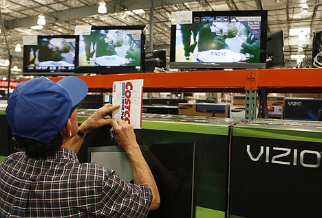 &lt;p&gt;A shopper notes television prices at the Costco Wholesale store in Glendale, Calif., on Feb. 28. Retailers reported solid revenue gains for February, extending the strong spending momentum seen during the holiday season as the economic recovery takes hold.&lt;/p&gt;