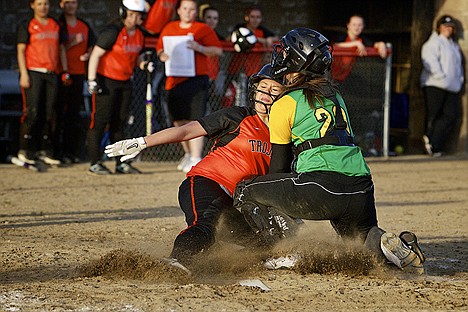 &lt;p&gt;Post Falls High's Amanda Frank collides with Lakeland High catcher Tifani Schorzman as she slides into home to score the game-winning run after Schorzman dropped the ball during the collision.&lt;/p&gt;