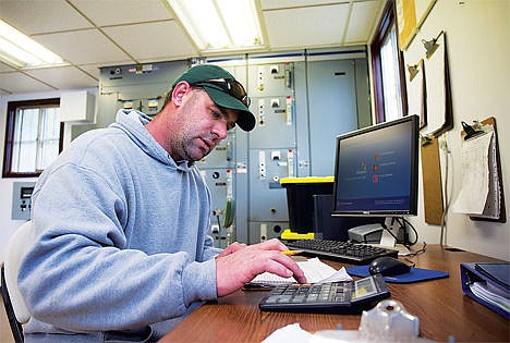 &lt;p&gt;Head spirit Lake Sewage Plane Operator Luke Eastman converts measurements taken from pond 1 and records them during the March 20 shift.&lt;/p&gt;