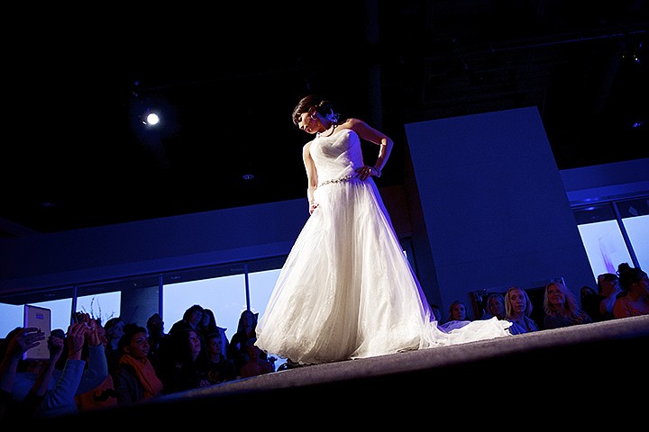 &lt;p&gt;JEROME A. POLLOS/Press Lindsay Allen models one of the wedding gowns on display from Storybook Bridal during one of the Inland Northwest Bride Expo fashion shows held Thursday at The Hagadone Event Center in Coeur d'Alene.&lt;/p&gt;