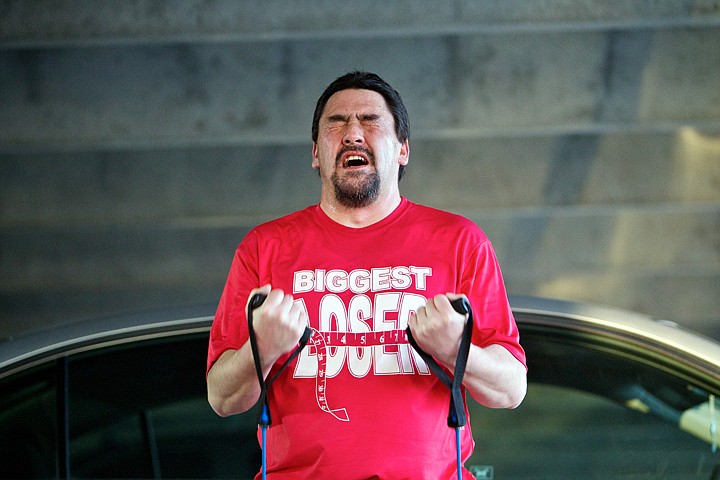 &lt;p&gt;Duane Smith fights to finish a set of curls during a strenuous hour-long workout Tuesday for the Biggest Loser Challenge through Peak Health and Wellness.&lt;/p&gt;