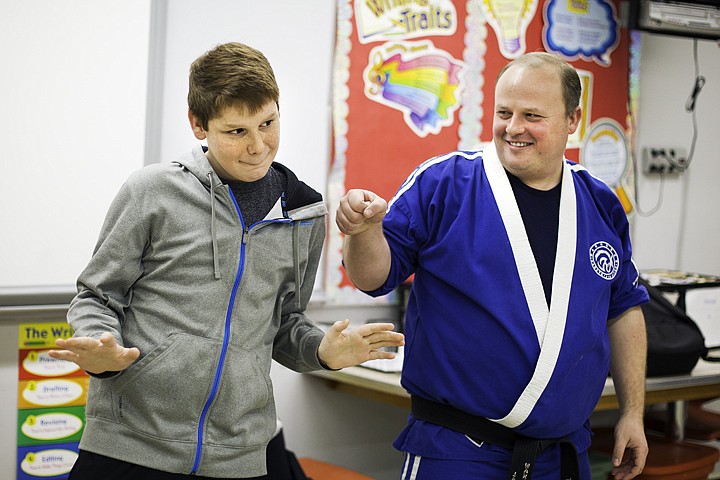 &lt;p&gt;SHAWN GUST/Press Jaime Thayne, an eighth-grade student at Post Falls Middle School, celebrates after winning a game as Jared Grile, an instructor with Warhorse Karate, looks for a fist bump Wednesday during the Career Day. Nearly 30 local community and business leaders presented various career opportunities to students of the middle school.&lt;/p&gt;