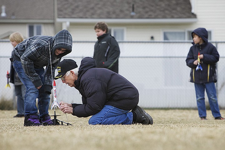 &lt;p&gt;JEROME A. POLLOS/Press Bruce Chittenden, a retired teacher, assists Cole Walker, 11, in preparing his model rocket for flight Tuesday during launch day of the rocketry class in the Dynamic After School Hours (DASH) program at Ramsey Magnet School of Science in Coeur d'Alene.&lt;/p&gt;