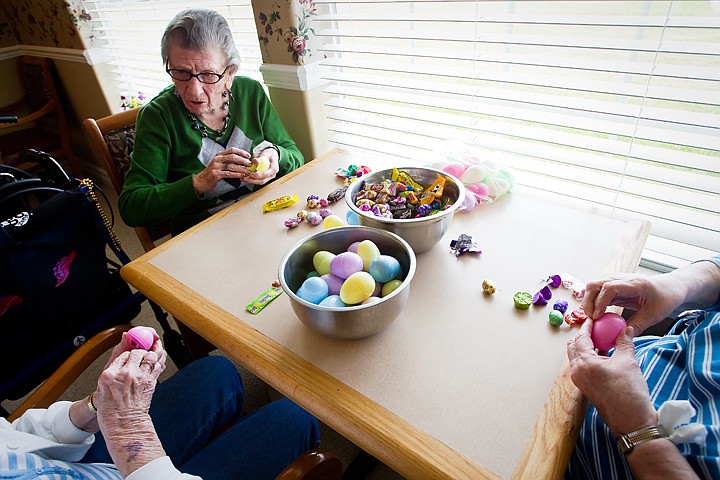 &lt;p&gt;SHAWN GUST/Press Betty Zuege, a resident at Four Seasons Assisted Living in Coeur d'Alene, fills plastic eggs with fellow residents Tuesday in preparations for a community Easter egg hunt on Saturday beginning at 1:30 p.m. Approximately 20 residents participated in the task of filling roughly 1,000 eggs with 136 pounds of candy. Children ages 0-12 are encouraged to attend. For more information call 665-2100.&lt;/p&gt;