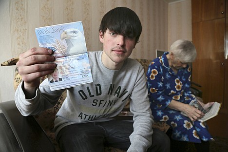 &lt;p&gt;In this photo taken on March 20, Alexander Abnosov shows his American passport to journalists in the Volga river city of Cheboksary, Russia. His 72 -years old grandmother is in the background.&lt;/p&gt;