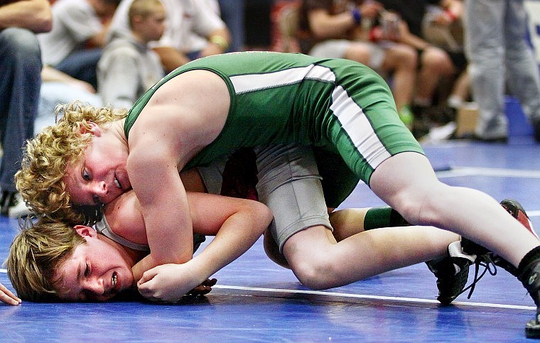 Cody Decker of Kalispell wrestles against Robert Few of Hamilton Saturday afternoon at the State Little Guy Wrestling Tournament at Columbia Falls High School Saturday afternoon.