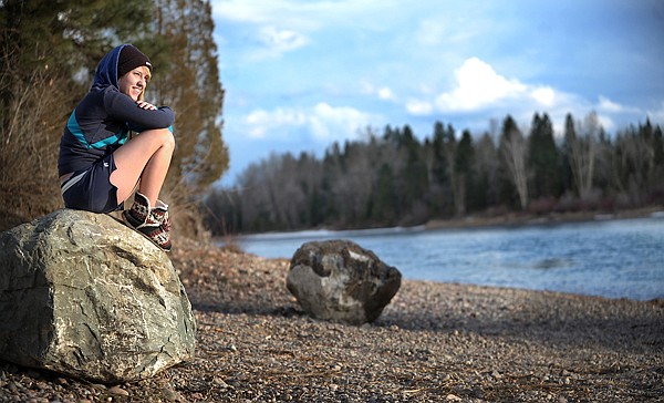 Tina Sullivan, 17, of Columbia Falls, enjoys the sunset along the Flathead River on Thursday near Columbia Falls.