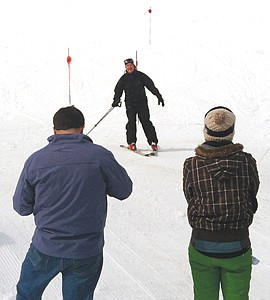 &lt;p&gt;Perry Stebbins, who runs Perry&#146;s Powder Palace rental shop at Turner Mountain, completes the downhill portion of the Top to Dog race as onlookers cheer him on.&#160;&lt;/p&gt;