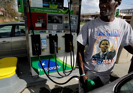 &lt;p&gt;FILE - In this Friday, March 16, 2012 file photo, Henry Rice, of Atlanta, pumps gas, at a station in Atlanta. Americans' rosy outlook about the U.S. economy remains resilient as they focus on the good in the barrage of conflicting economic news. A widely watched barometer of consumer confidence barely budged in March after hitting its highest level since before the financial crisis began in the previous month. Americans continued to be upbeat in March despite mixed economic signs. The stock market is up, but gas prices are, too. Unemployment is falling, but home prices also are declining. (AP Photo/David Goldman)&lt;/p&gt;