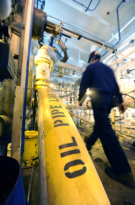 &lt;p&gt;FILE - In this May 1, 2009 file photo, an operator walks by the main oil line on offshore oil drilling platform 'Gail' operated by Venoco, Inc. off the coast of California near Santa Barbara, Calif. Oil prices fell to around $81 a barrel Tuesday, March 23, 2010, as the U.S. dollar strengthened, making crude more expensive for investors with other currencies.(AP Photo/Chris Carlson, file)&lt;/p&gt;