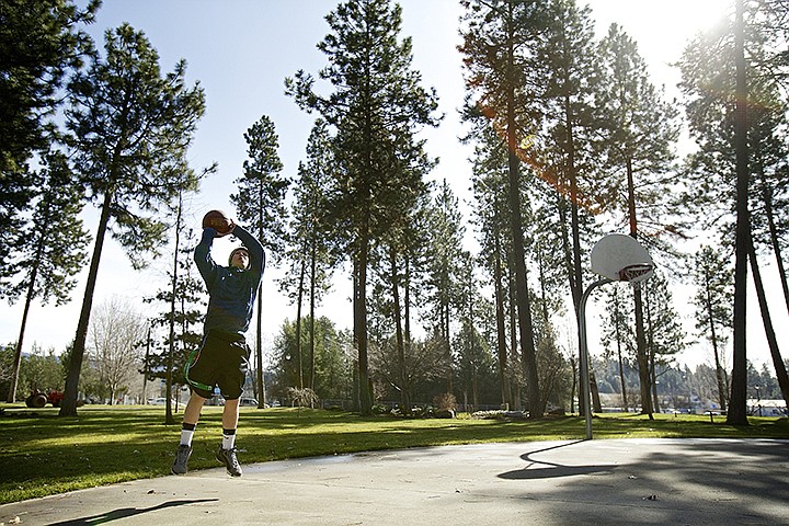 &lt;p&gt;JEROME A. POLLOS/Press Jeff Pabst, 17, shoots hoops under a sunny sky Tuesday at Ramsey Park in Coeur d'Alene on the last day of winter.&lt;/p&gt;