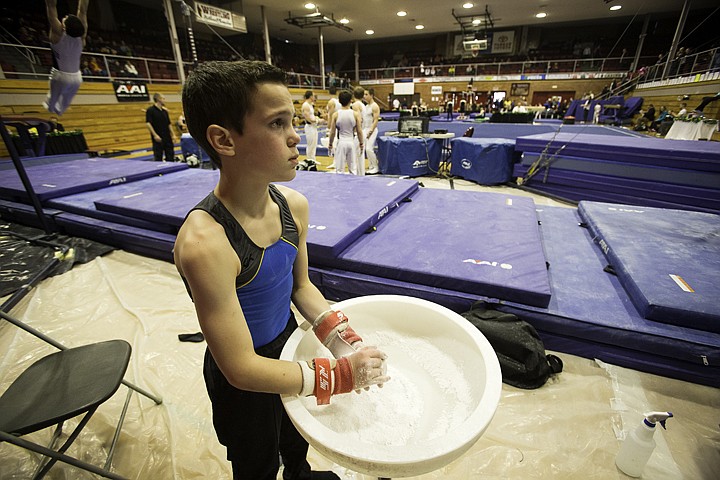 &lt;p&gt;SHAWN GUST/Press Nick Ancker, of Hayden, applies chalk to his hands prior to competing in the skill rings event.&lt;/p&gt;