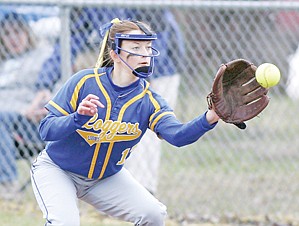 <p>Second baseman Rachel Rebo backs up Devon Gallagher at first for the second out top of 2 vs. the Priest River Spartans. The Lady Loggers went on to win the 7-inning contest 8 to 3 on a very soggy field.</p>