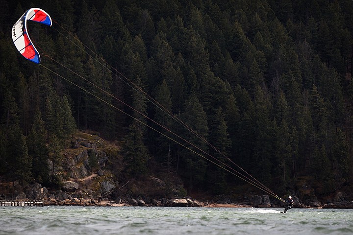 &lt;p&gt;SHAWN GUST/Press Jeff Yates surfs on the surface of Lake Coeur d'Alene Monday while kitesurfing near Tubbs Hill. Yates took advantage of high winds to makes dozens of zig zags across the lake.&lt;/p&gt;