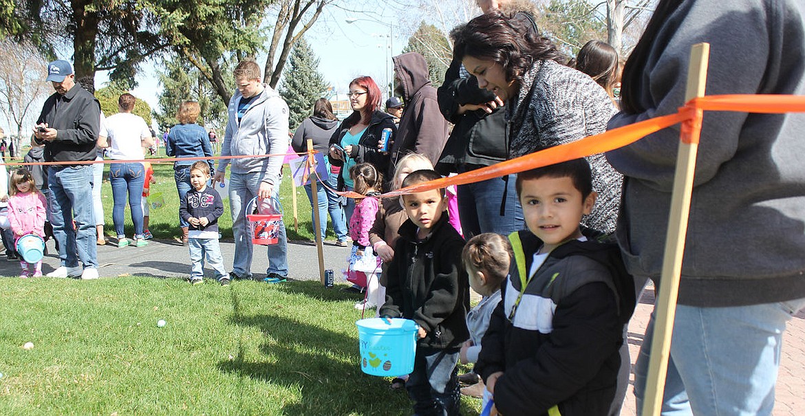 Kids eagerly await the start of the Easter egg hunt at McCosh Park on Saturday.