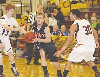 &lt;p&gt;Ronan&#146;s Carston Baertsch drives past Charlo&#146;s Kail Pope and his own Chiefs teammate Zachary Wagner Friday night.&#160; Baertsch, a senior, scored five points in his final basketball game as a Ronan Chief.&#160;&lt;/p&gt;