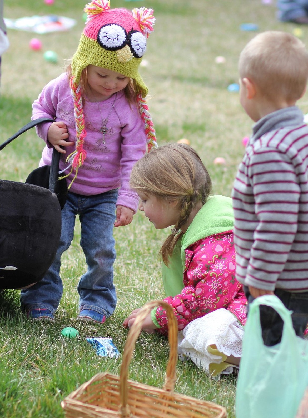 &lt;p&gt;Stella Rausch, 2, along with Piper, 3, and Boaz McGuffey, 2, work at collecting their share of eggs at the hunt in Superior on Saturday.&lt;/p&gt;