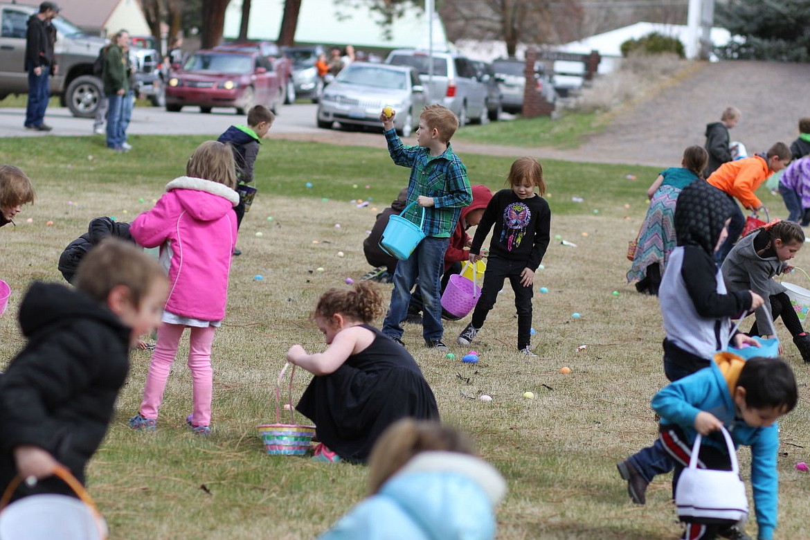 <p>A Superior boy holds up a prize egg he found as part of the town’s annual Easter egg hunt on Saturday</p>