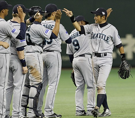 &lt;p&gt;Seattle Mariners rightfielder Ichiro Suzuki, right, celebrates with teammates after beating the Oakland Athletics 3-1 in their American League season opening MLB baseball game at Tokyo Dome in Tokyo, Wednesday, March 28, 2012. (AP Photo/Koji Sasahara)&lt;/p&gt;