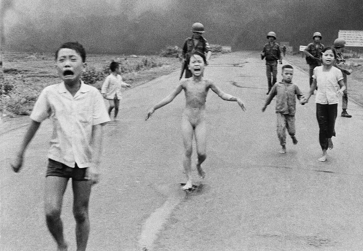 &lt;p&gt;South Vietnamese forces follow terrified children, including 9-year-old Kim Phuc, center, as they run down Route 1 near Trang Bang after an aerial napalm attack on suspected Viet Cong hiding places on June 8, 1972. A South Vietnamese plane accidentally dropped its flaming napalm on South Vietnamese troops and civilians. The terrified girl had ripped off her burning clothes while fleeing. The children from left to right are: Phan Thanh Tam, younger brother of Kim Phuc, who lost an eye; Phan Thanh Phouc, youngest brother of Kim Phuc; Kim Phuc; and Kim&#146;s cousins Ho Van Bon and Ho Thi Ting. Behind them are soldiers of the Vietnam Army 25th Division.&lt;/p&gt;