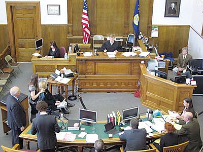<p>District Judge Ray Dayton, center, addresses the attorneys during jury selection in the dark money trial of a Montana lawmaker in Helena, Mont., Monday, March 28, 2016. Rep. Art Wittich, second from right at table, is accused of taking illegal corporate contributions during his 2010 election campaign. (AP Photo/Matt Volz)</p>