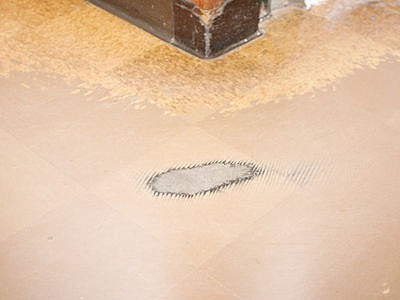 &lt;p&gt;Tile wear in hallway of middle/high school, right down to the cement.&lt;/p&gt;