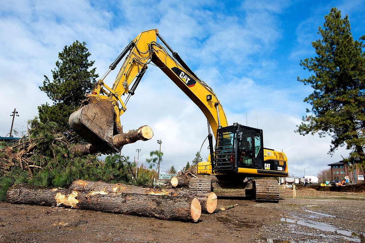 &lt;p&gt;Barney Higbee on Cannon Hill Industries operates an excavator to move tree trunks on Monday as the building site near Memorial Field of the Four Corners Project is cleared of trees.&lt;/p&gt;