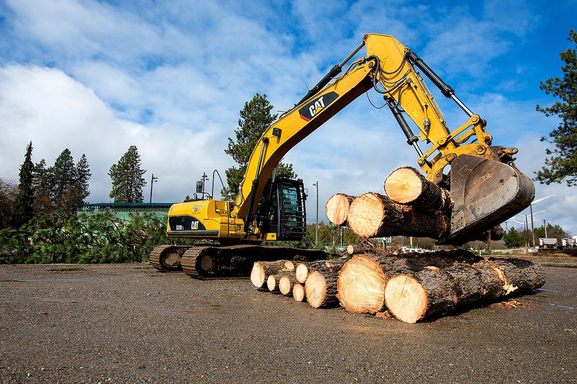 &lt;p&gt;JAKE PARRISH/Press Barney Higbee on Cannon Hill Industries operates an excavator to move tree trunks on Monday as the building site near Memorial Field of the Four Corners Project is cleared of trees.&lt;/p&gt;