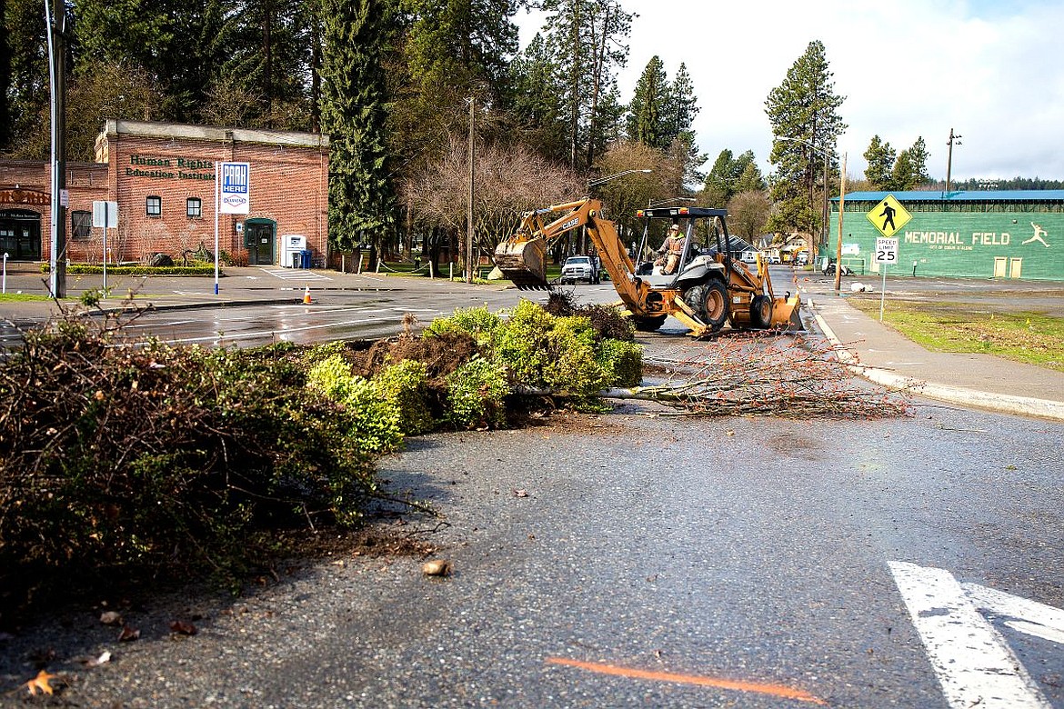 &lt;p&gt;Paul Speker of Cameron-Reilly Concrete operates a backhoe on Monday to tear up a flower bed in a median on Fort Grounds Drive in Coeur d'Alene. The street is a key component in the construction of the Four Corners Project.&lt;/p&gt;