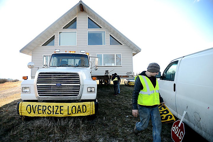 &lt;p&gt;The crew from D &amp; V Construction makes last minute adjustments as they prepare to relocated a two story house over to Sandy Hill Lane near Whitefish on Tuesday morning, March 29. (Brenda Ahearn/Daily Inter Lake)&lt;/p&gt;