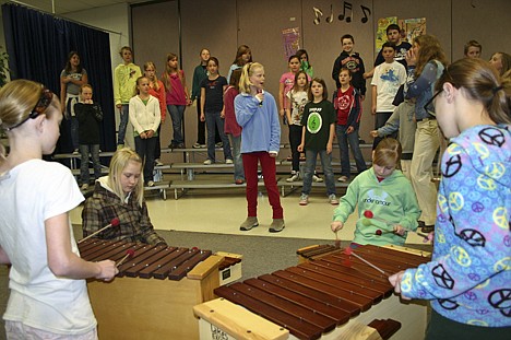 &lt;p&gt;Bailey Swoboda, center, watches teacher Julie Powell for direction as she performs a solo in &quot;Stand by Me&quot; during rehearsal of the combined choruses of Dalton and Fernan elementary schools.&lt;/p&gt;