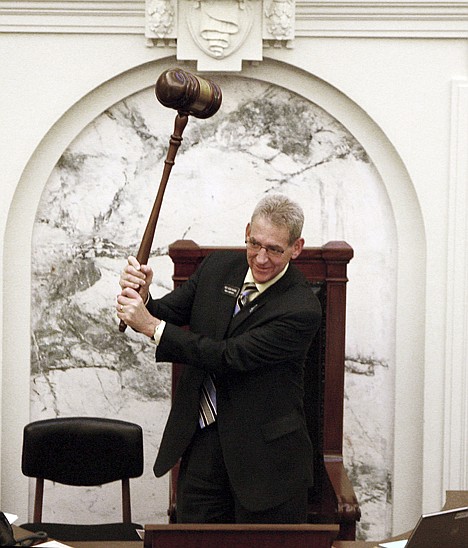 Rep. Bob Nonini, R-Coeur d'Alene, uses an over-sized gavel while the Idaho House of Representatives is at-ease Monday in Boise.