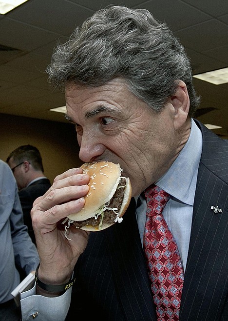 &lt;p&gt;Texas Gov. Rick Perry eats a hamburger which contains the beef product known as pink slime or lean finely textured beef following a news conference in South Sioux City, Neb., Thursday. Earlier, the governors of Nebraska and South Dakota toured the Beef Products Inc. plant where the product is made to show their support for the company and the several thousand jobs it creates in Nebraska, Iowa, Kansas, South Dakota and Texas.&lt;/p&gt;